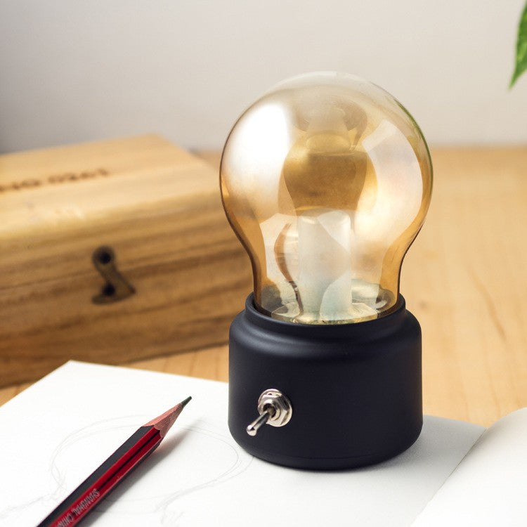 Lampa LED Decorativa sub forma de Bulb, Retro pentru interior, Negru/ Transparent, 5 V, 500 mA, ABS, Lumina Calda, Incarcare USB, Autonimie 12 Ore, Comutator Metalic,11x7x6 cm